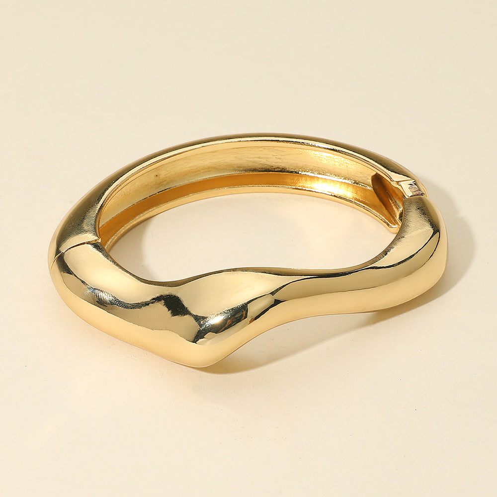 Sculptural gold hinged bracelet