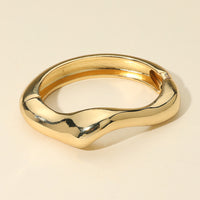 Sculptural gold hinged bracelet